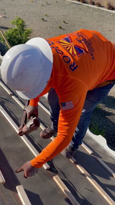 Roofer in MY ARIZONA ROOFING CONTRACTOR gear nailing roof battens